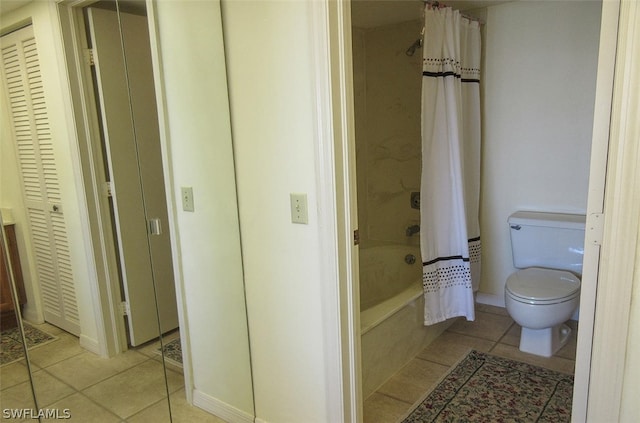 bathroom with shower / bathtub combination with curtain, toilet, and tile floors