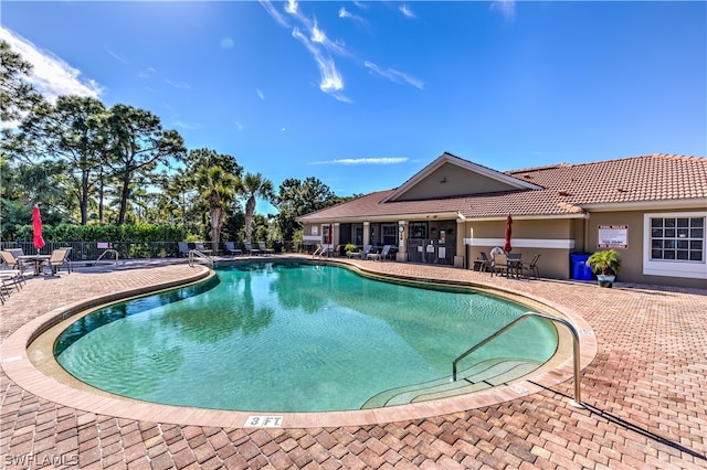 view of swimming pool with a patio area