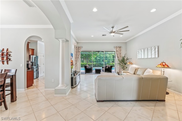 living room with crown molding, decorative columns, and ceiling fan