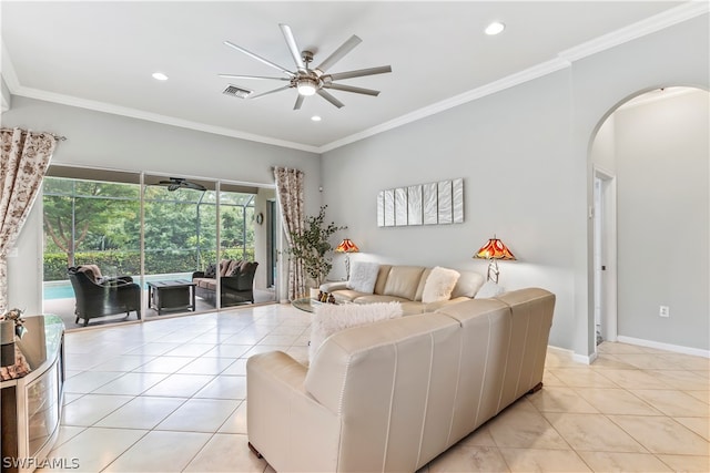 living room with light tile patterned floors, ornamental molding, and ceiling fan