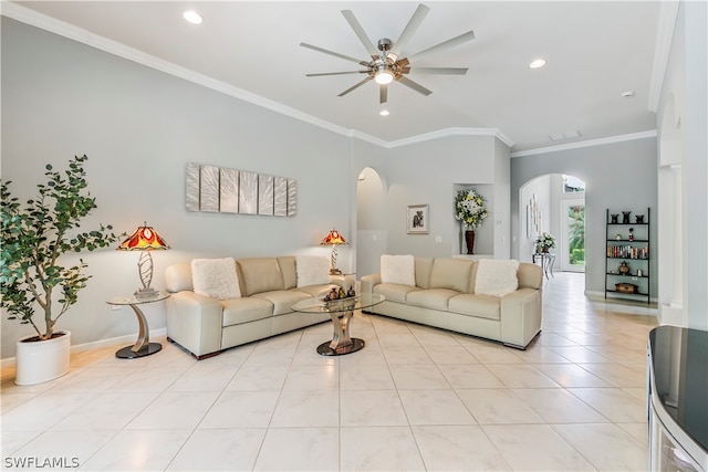 tiled living room with ceiling fan and crown molding