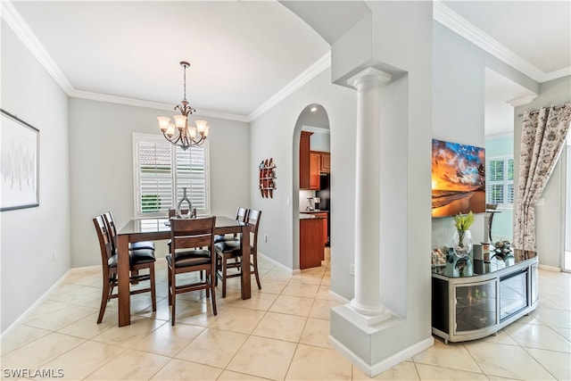 dining area with an inviting chandelier, decorative columns, light tile patterned floors, and ornamental molding