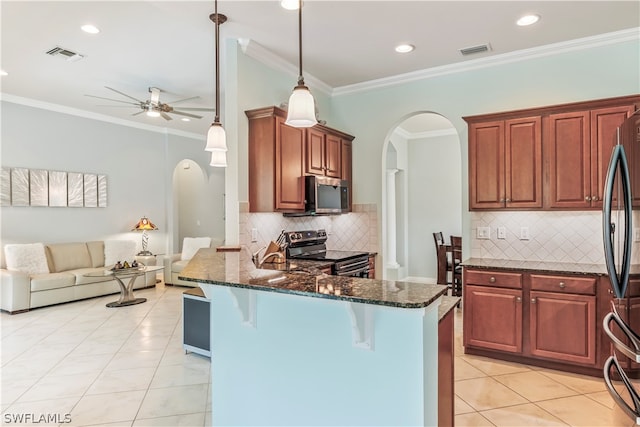 kitchen featuring appliances with stainless steel finishes, light tile patterned floors, decorative light fixtures, dark stone countertops, and ceiling fan