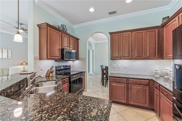 kitchen featuring tasteful backsplash, sink, stainless steel appliances, light tile patterned floors, and crown molding