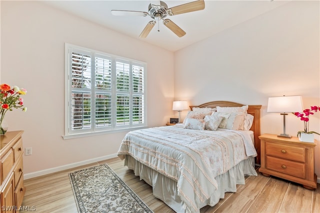 bedroom with light wood-type flooring and ceiling fan