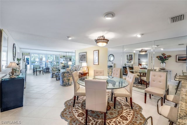 dining space featuring light tile patterned floors