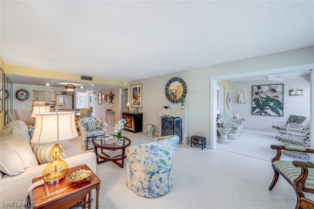 living room with a textured ceiling