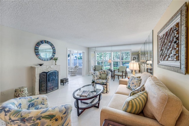 living room featuring light tile patterned floors and a textured ceiling