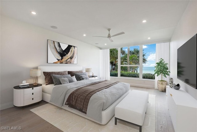 bedroom with light hardwood / wood-style flooring and ceiling fan