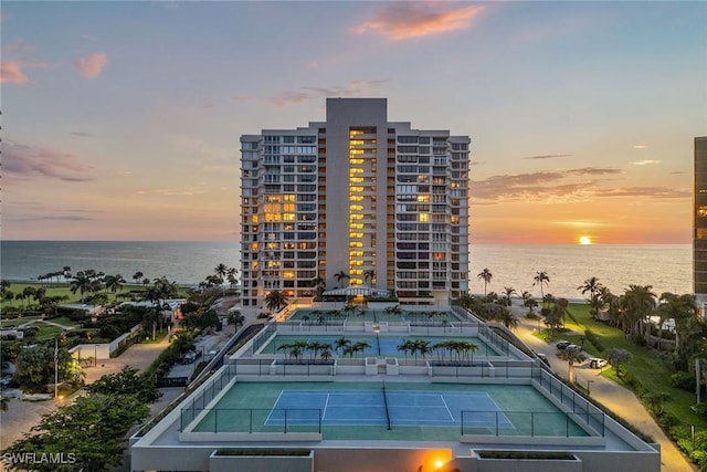 outdoor building at dusk featuring a water view