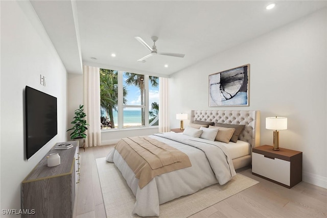 bedroom with ceiling fan and light wood-type flooring