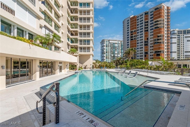 view of swimming pool featuring a patio area