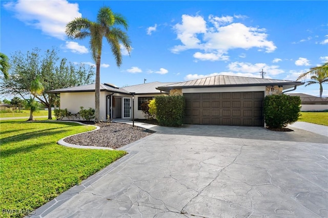 single story home with a garage and a front lawn