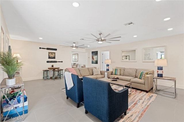 tiled living room with ceiling fan