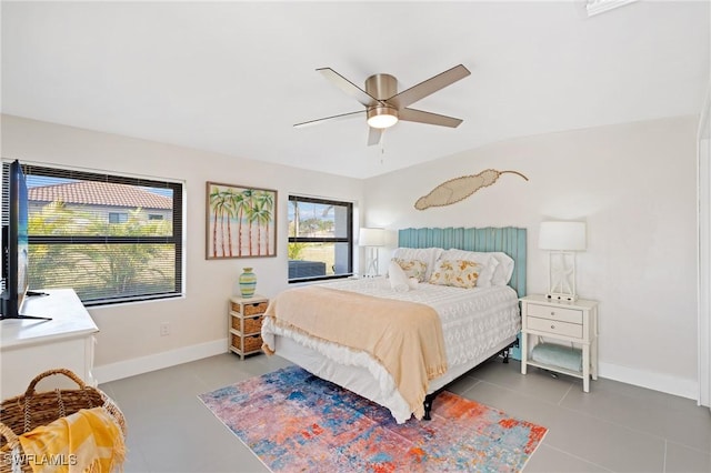 bedroom with tile patterned flooring and ceiling fan