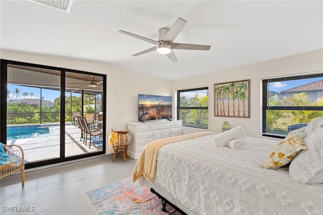 bedroom with multiple windows, access to exterior, light tile patterned floors, and ceiling fan