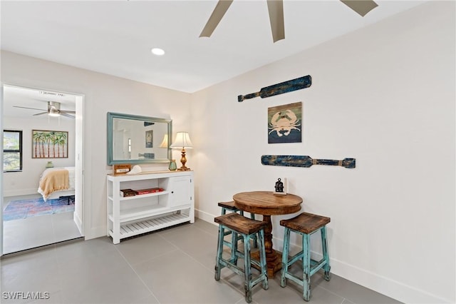 dining room with tile patterned flooring and ceiling fan