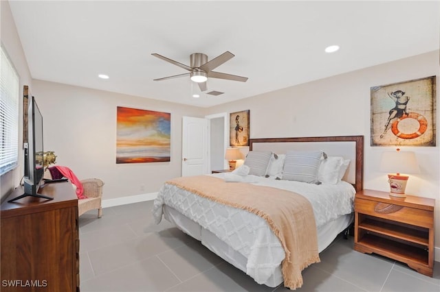 bedroom with tile patterned flooring, ceiling fan, and multiple windows