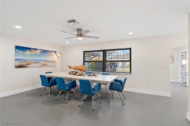 tiled dining room with ceiling fan