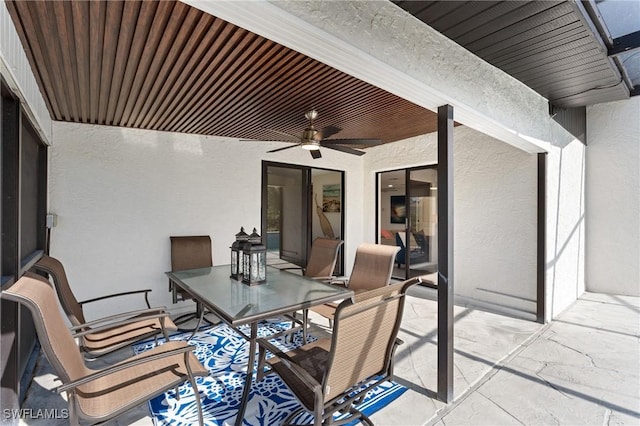 view of patio featuring ceiling fan