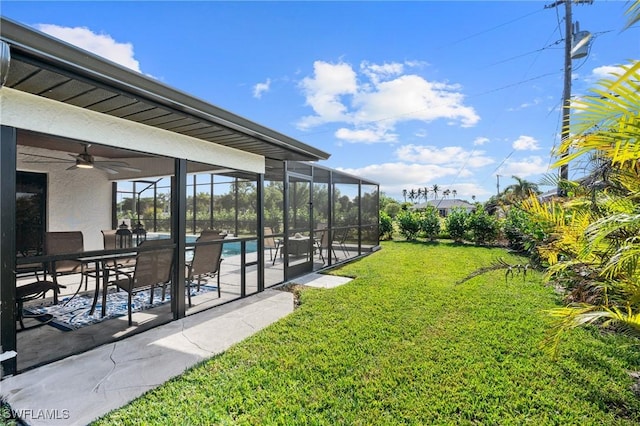 view of yard with a patio, a lanai, and ceiling fan