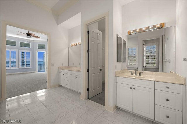 bathroom with ceiling fan and vanity