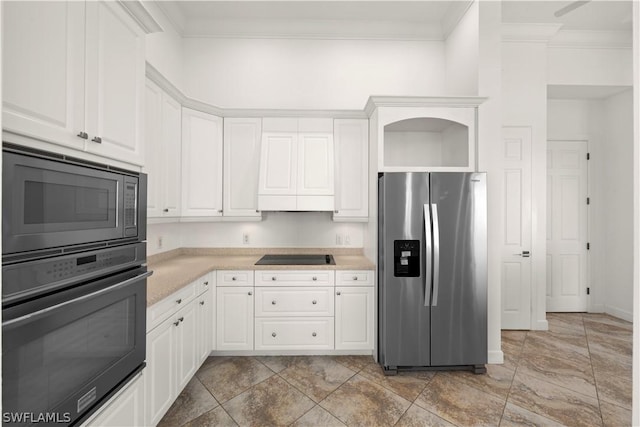 kitchen with black appliances, white cabinetry, crown molding, and exhaust hood