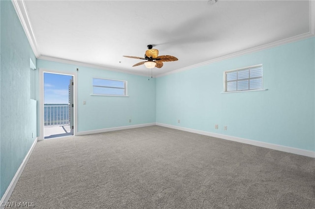 unfurnished room featuring carpet flooring, ceiling fan, and ornamental molding