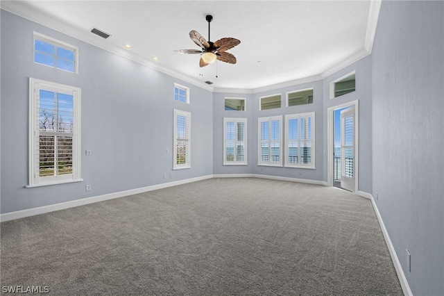 carpeted spare room with ceiling fan and ornamental molding