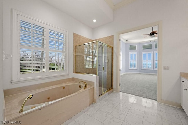 bathroom featuring vanity, ceiling fan, and independent shower and bath