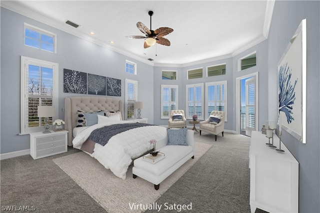 carpeted bedroom featuring ceiling fan and crown molding