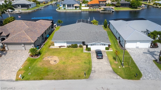 birds eye view of property with a water view