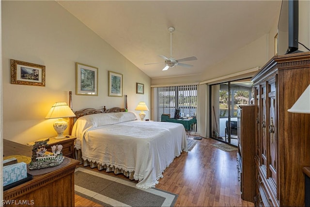 bedroom featuring hardwood / wood-style floors, access to exterior, ceiling fan, and vaulted ceiling