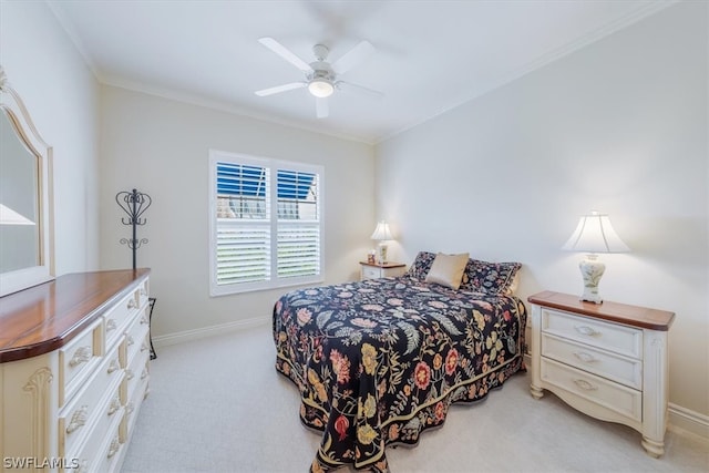 bedroom with ceiling fan, light colored carpet, and ornamental molding