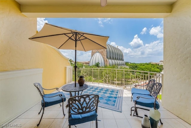 view of patio featuring a balcony