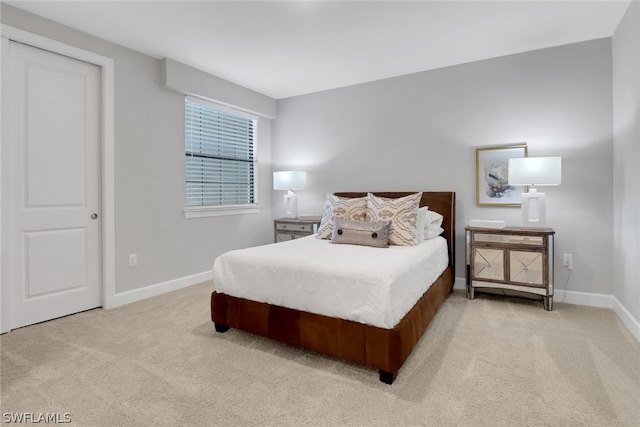 bedroom featuring light colored carpet