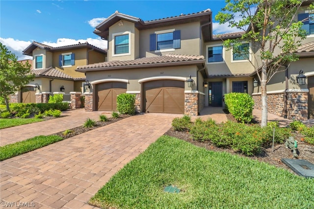 mediterranean / spanish-style house featuring a garage