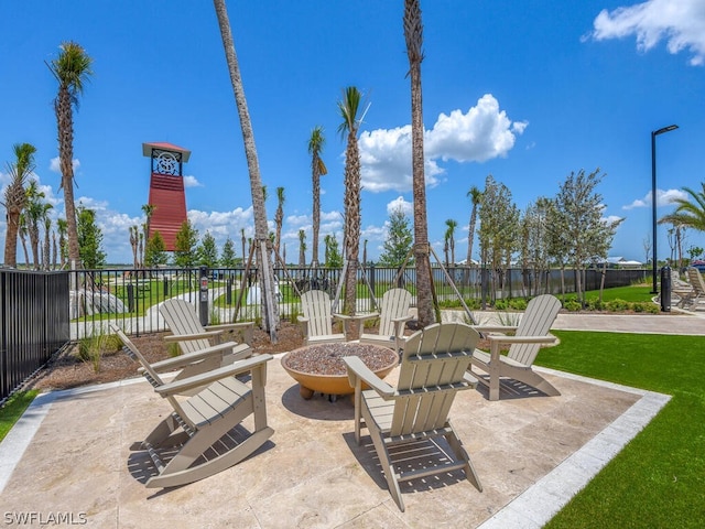 view of terrace featuring an outdoor fire pit