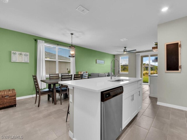 17941 Saddle Rd, Punta Gorda, FL 33982 - kitchen featuring stainless steel dishwasher, a sink, light countertops, baseboards, and recessed lighting