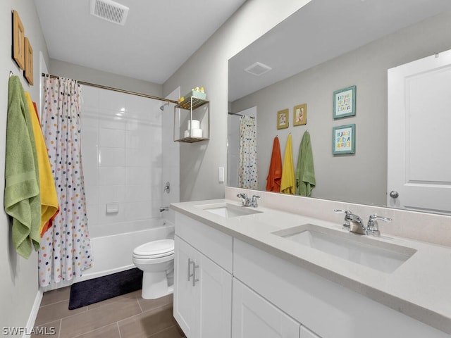 17941 Saddle Rd, Punta Gorda, FL 33982 - bathroom with double vanity, toilet, shower / bathtub combination with curtain, tile patterned flooring, and baseboards