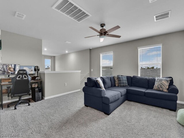 living room with carpet and ceiling fan