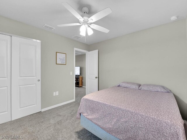 17941 Saddle Rd, Punta Gorda, FL 33982 - carpeted bedroom with baseboards, ceiling fan, and a closet