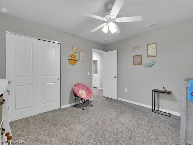 interior space featuring a closet, ceiling fan, and carpet floors