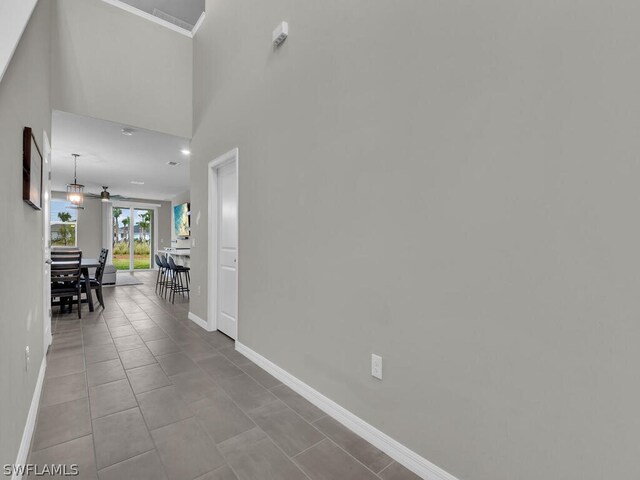 17941 Saddle Rd, Punta Gorda, FL 33982 - hall with baseboards, ornamental molding, and tile patterned floors
