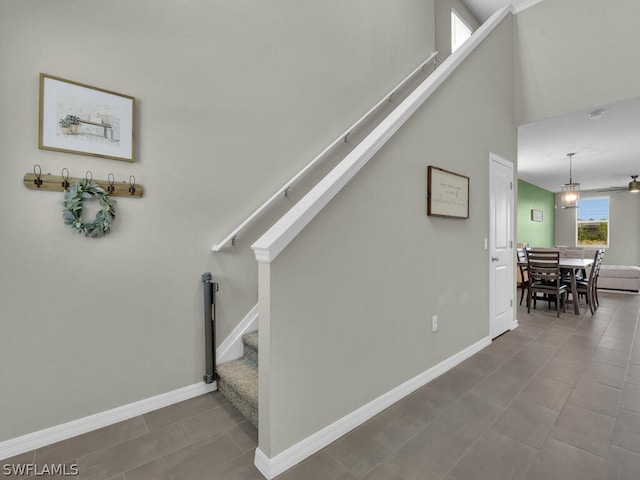 17941 Saddle Rd, Punta Gorda, FL 33982 - stairway featuring baseboards, ceiling fan, and tile patterned floors