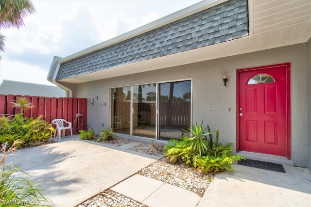 entrance to property with a patio