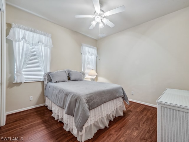 bedroom featuring dark wood-type flooring and ceiling fan