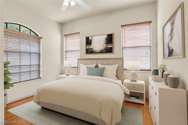 bedroom featuring hardwood / wood-style floors and ceiling fan