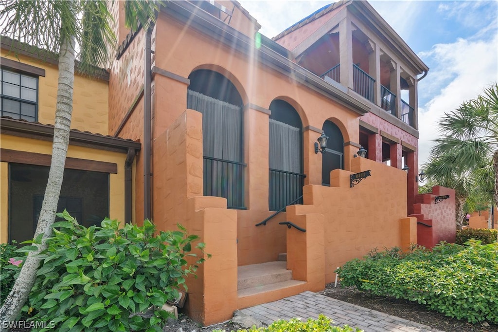 view of front of home with a balcony