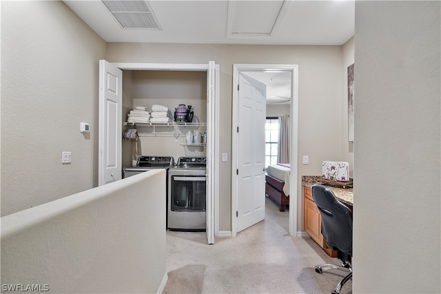 hall featuring independent washer and dryer